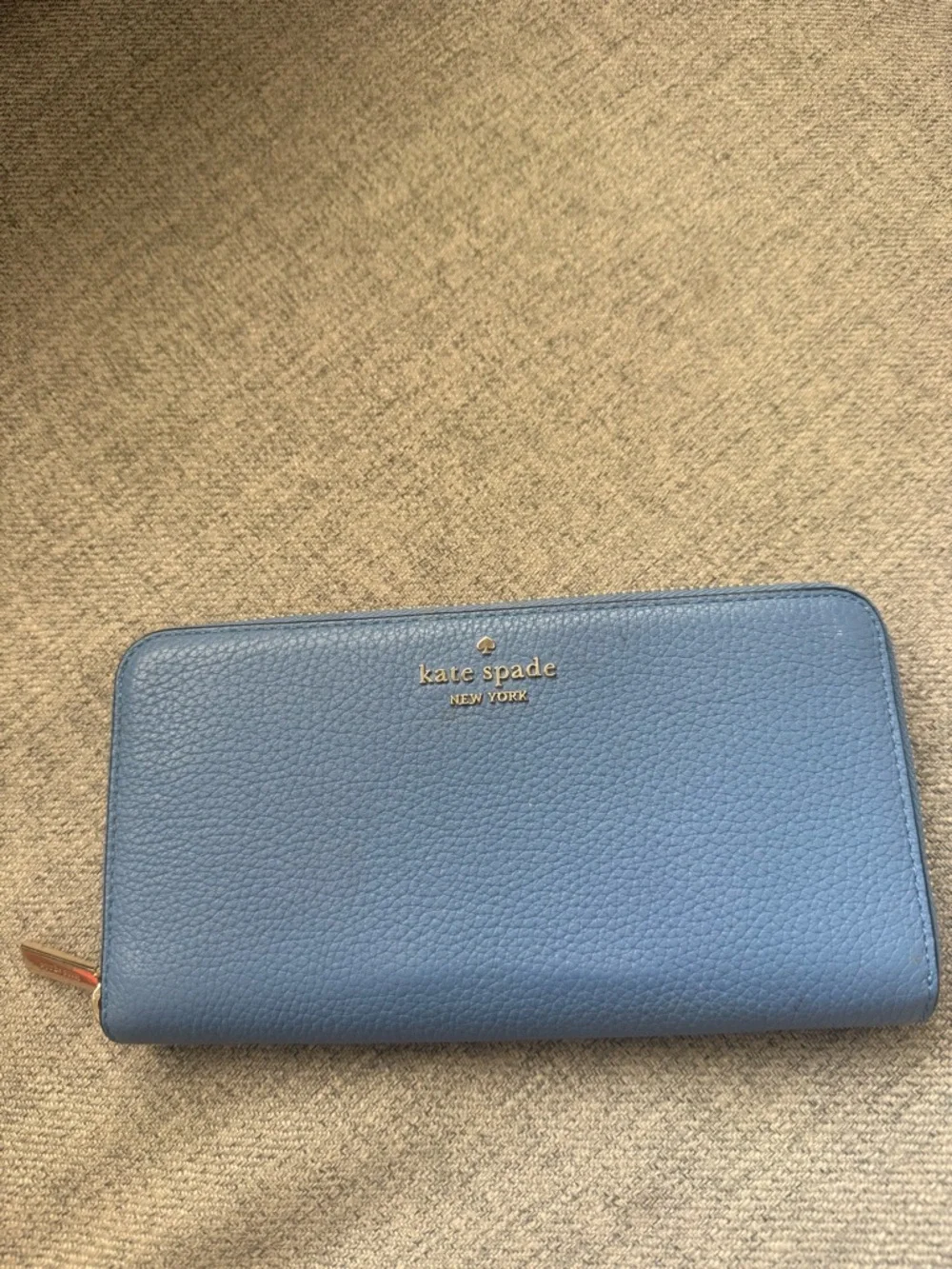 kate spade blue pebbled zip-around wallet with gold logo